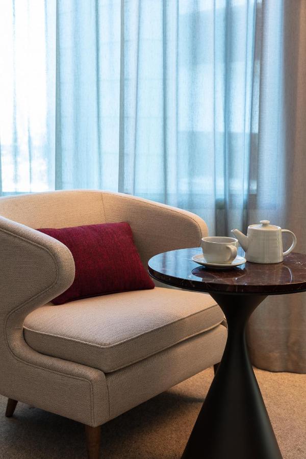 Next Hotel Melbourne, Curio Collection By Hilton Extérieur photo A tea set